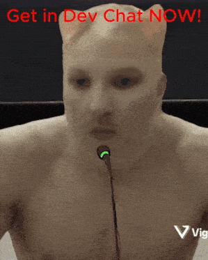 a shirtless man speaking into a microphone with the words " get in dev chat now " behind him