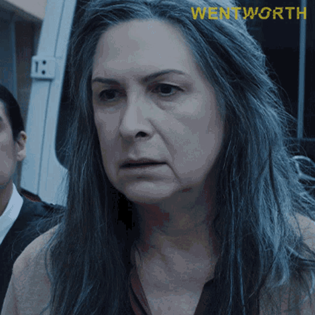 a close up of a woman 's face with the word wentworth written on the bottom