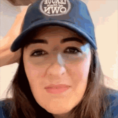 a woman wearing a blue hat that says two