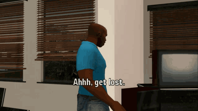 a man in a blue shirt says " ahhh get lost " in front of a window