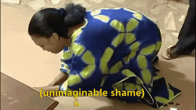 a woman in a blue and green dress is kneeling down with the words unimaginable shame above her