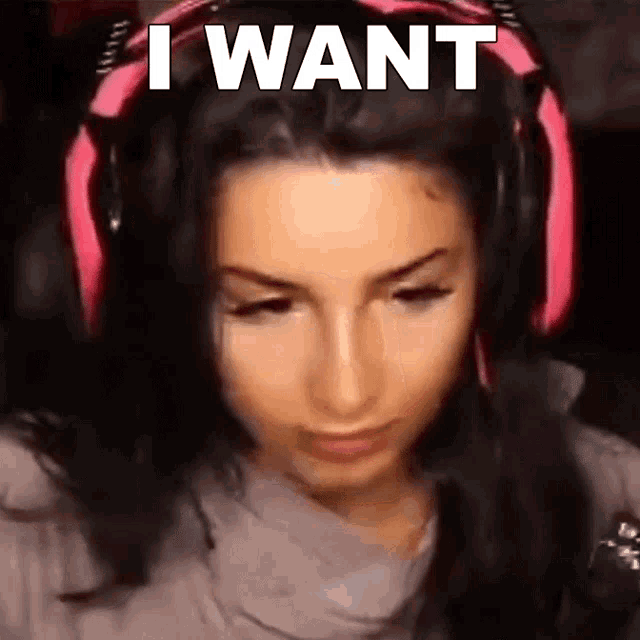 a woman wearing headphones with the words `` i want '' written on her head .