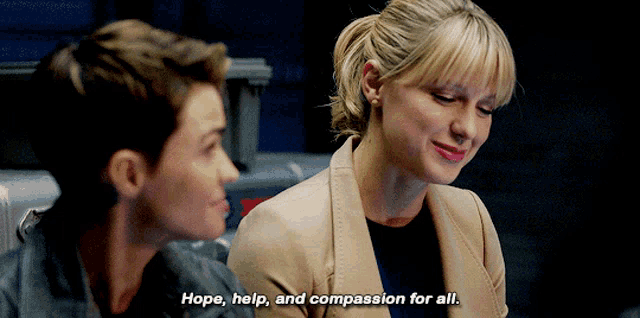 a woman says hope help and compassion for all while sitting next to another woman