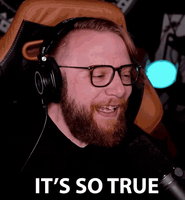 a man with glasses and headphones says it 's so true in front of a microphone