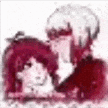 a man and a woman are sitting next to each other on a white surface .