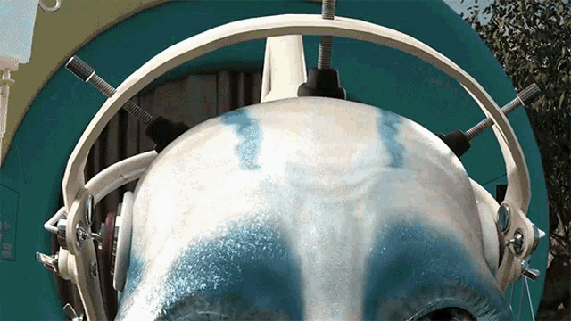 a close up of a head with headphones on it