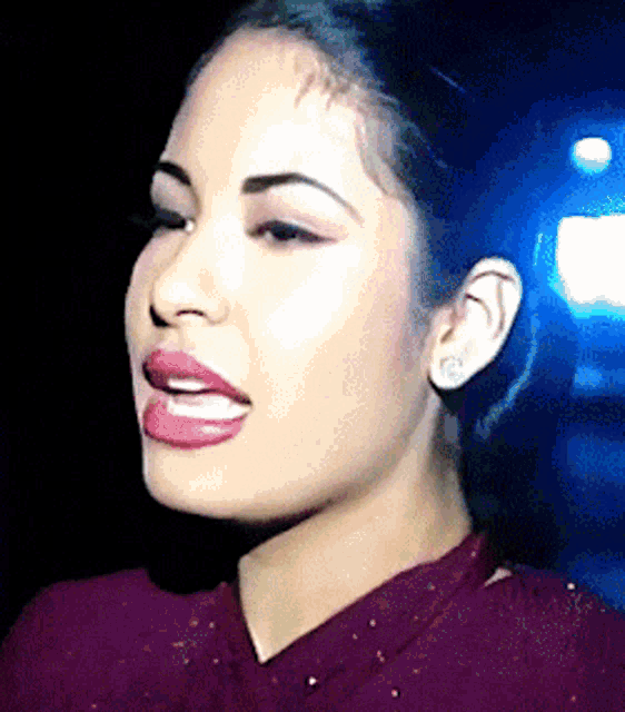 a close up of a woman 's face with pink lips