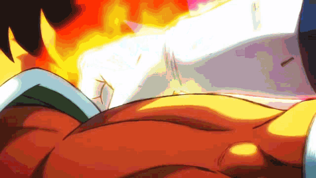 a close up of a person 's chest with flames behind him