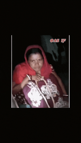 a woman in a red scarf sits in a dark room with the words gas if written above her