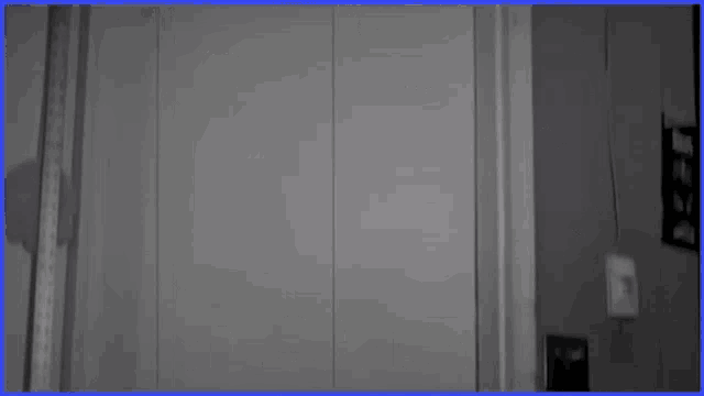 a black and white photo of a person standing in a doorway with the words fellas on the bottom