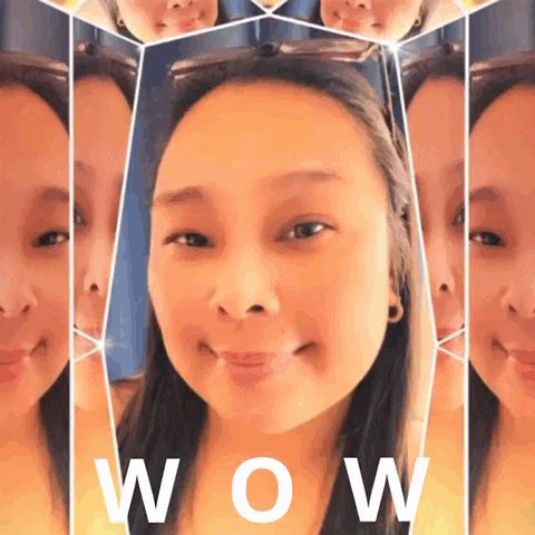 a woman 's face is surrounded by mirrors and the word wow is on the bottom right