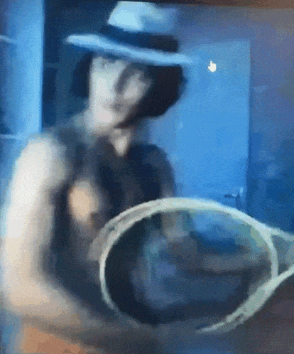 a man in a white hat is holding a bucket