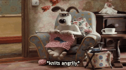 a cartoon dog is sitting in a chair knitting