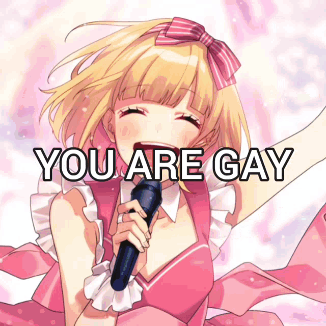 a girl in a pink dress singing into a microphone with the words you are gay above her