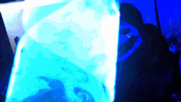 a blurry picture of a person 's face with a blue background
