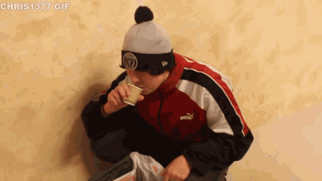 a gif of a man drinking from a cup with chris1377 written on the bottom