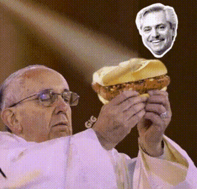 a priest is holding a sandwich with a picture of a man on it