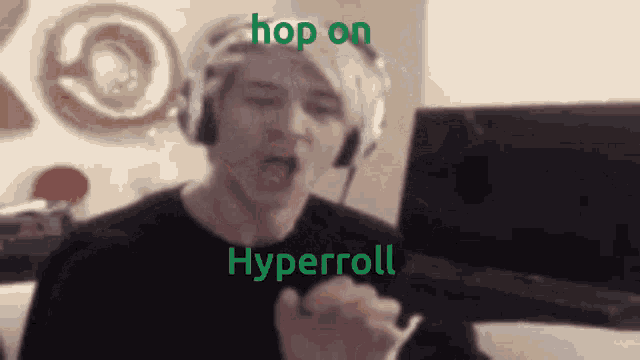 a man wearing headphones says hop on hyperroll in front of a computer