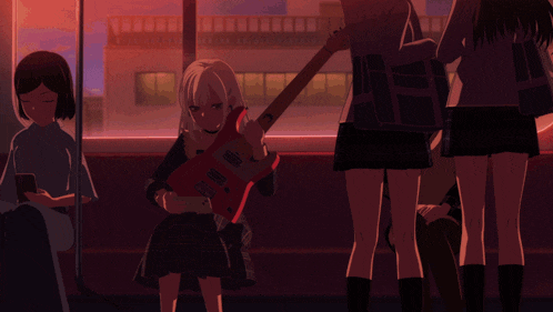 a girl is holding a red guitar while sitting on a bus with other girls