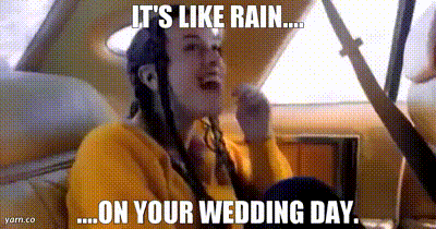 a woman sitting in the back seat of a car with a caption that says it 's like rain on your wedding day .
