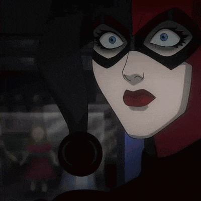 a close up of harley quinn 's face in a cartoon with a mask on .