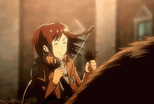 a girl is holding a feather in her hand and smiling .