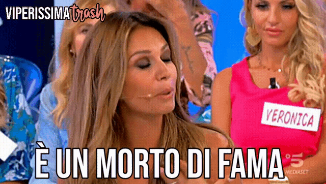 a woman in a pink tank top with the name veronica on it