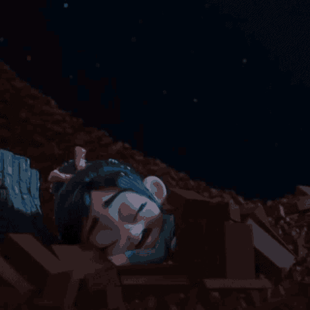 a cartoon character is sleeping in a pile of rocks