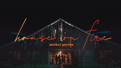 a poster for mickey guyton 's house on fire features a barn at night
