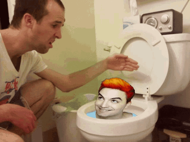 a man sitting in a toilet with a picture of a man in the toilet