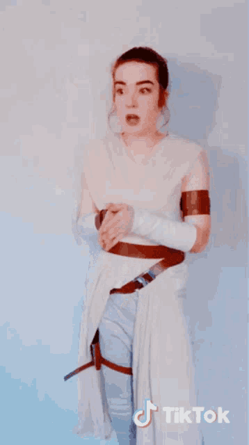 a woman in a star wars costume has tiktok written on the bottom right