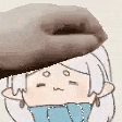 a person is holding a donut over their head .