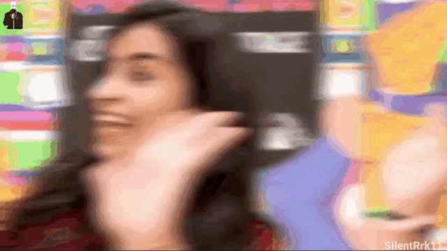 a blurry image of a woman 's face with the words silentrrk11 at the bottom