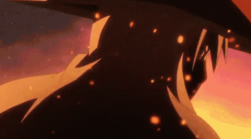 a close up of a person 's face with fire coming out of it