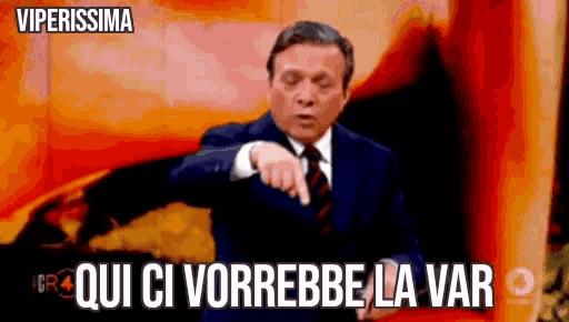 a man in a suit and tie is pointing at something with the words viperissima in the background