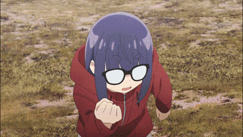 a girl with glasses and a red jacket is standing in the grass