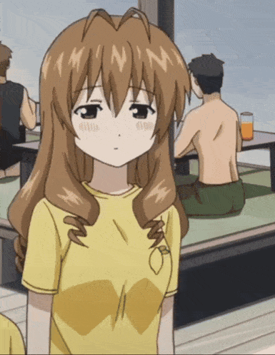 a girl wearing a yellow shirt with a lemon on her chest