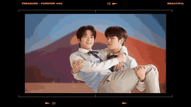 a man is carrying another man in his arms with the words " treasure forever 400 " above them