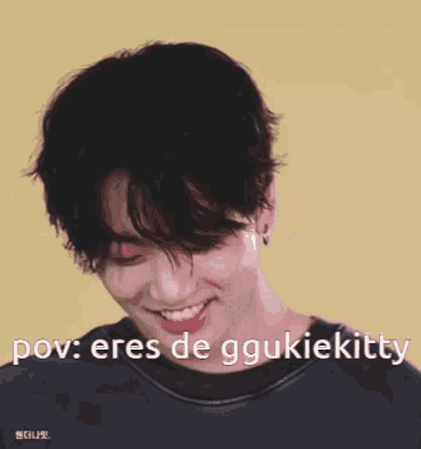 a close up of a person 's face with the words " pov : eres de ggukiekitty " written on it .