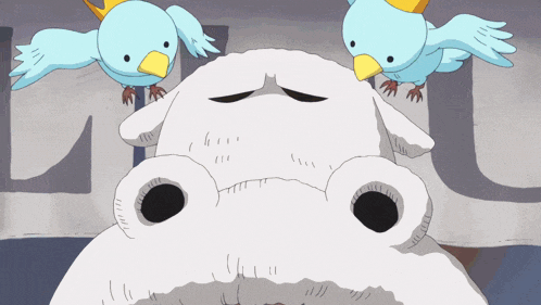 two blue birds are sitting on top of a white cartoon character