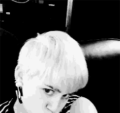 a black and white photo of a woman with short hair