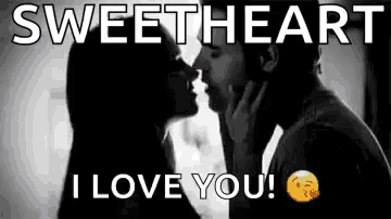 a black and white photo of a man and a woman kissing .