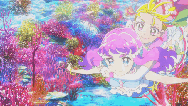 two anime girls are swimming in the ocean with corals in the background