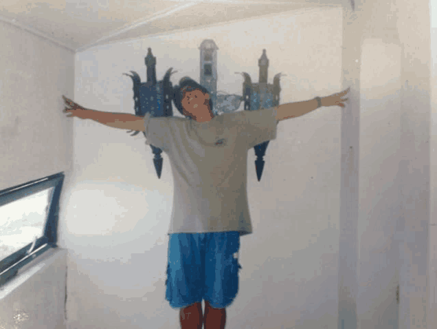 a man stands with his arms outstretched in front of a painting of a castle on a wall