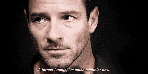 a close up of a man 's face with the words " a former lunatic i 'm much healthier now "