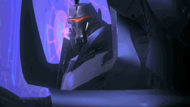 a robot is sitting in a dark room with a blue background