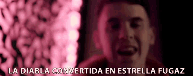 a close up of a man 's face with the words la diabla convertida en estrella fugaz below him