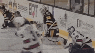 a hockey player with the number 31 on his jersey is kneeling on the ice