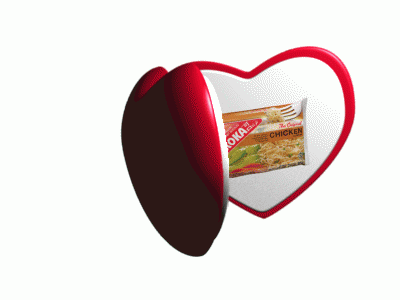 a heart shaped box with kola chicken inside of it