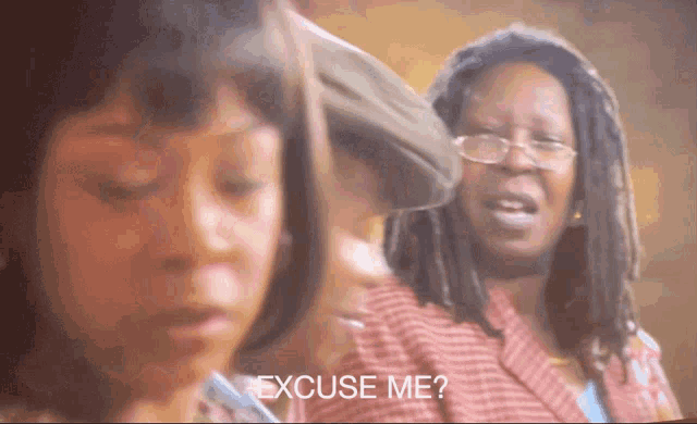 a woman with glasses says excuse me